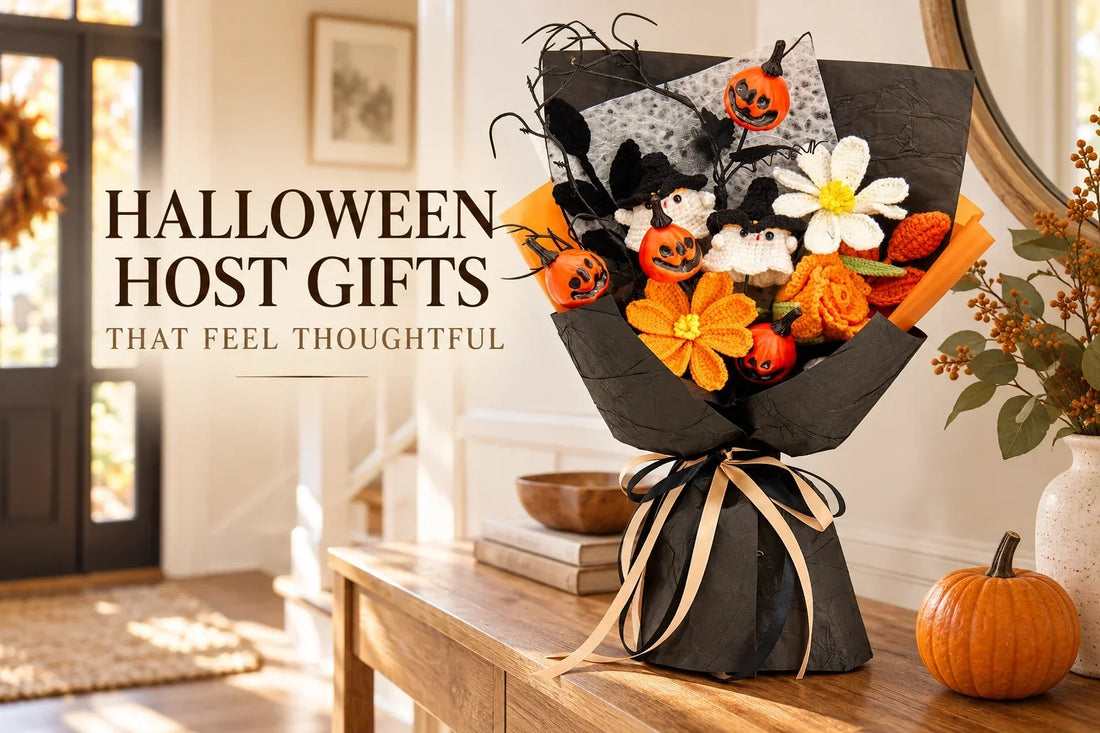 Halloween host gift bouquet with crochet ghosts, orange flowers and pumpkin decorations on an entryway console