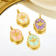 Enamel and crystal gold-plated pendant that opens to hold a photo