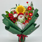 緑と赤のかぎ針編みクリスマスの花束と父のクリスマスとジンジャーブレッドの男