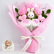 Crochet bouquet with a bunny centrepiece, crochet hearts and roses
