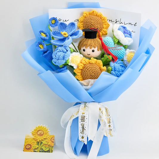 Blue and yellow crochet graduation bouquet with a graduate doll in a cap