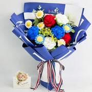 Crochet bouquet of six roses and six daisies in blue, red and white