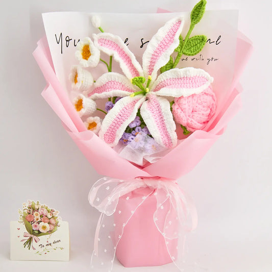 Crochet bouquet with a gradient pink and white lily and matching pink flowers