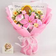 Pink crochet bouquet of sunflower, lily, rose and carnation with 14 blooms