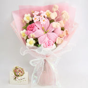 Full pink crochet lily and rose bouquet with greeting card and white ribbon