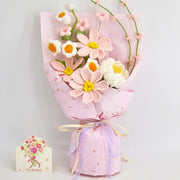 Crochet bouquet of pink Galsang flowers with a white peony