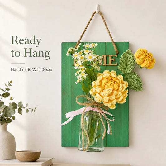 Green wall decor board with glass vase and crochet flowers