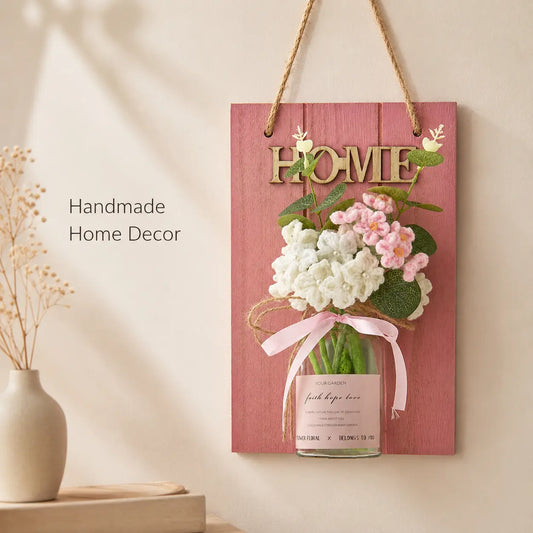 Pink wall decor board with glass vase and crochet flowers