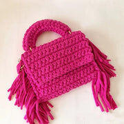 Rose red crochet handbag with long tassels on both sides