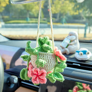 Pink crochet car hanging with flowers and leaves