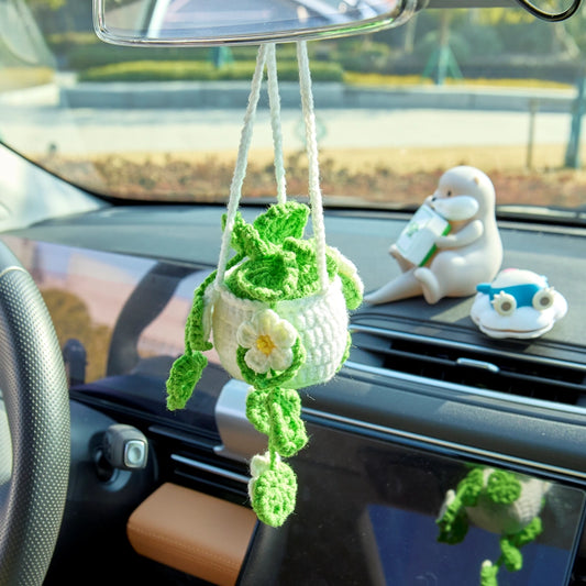 Hollowed-out crochet hanging pot in light green with white flowers