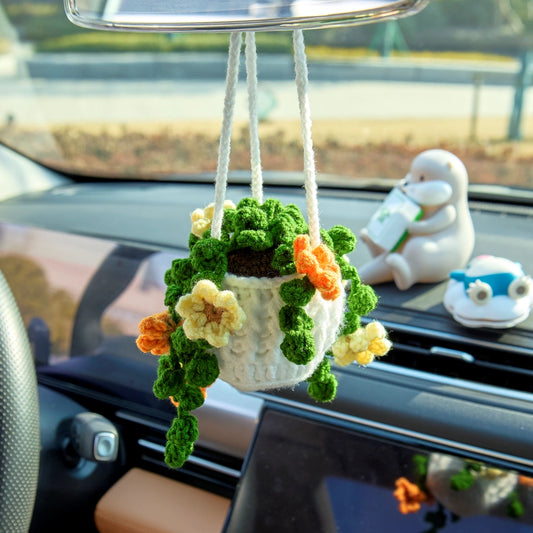Crochet hanging flower pot with six branches of yellow and orange flowers