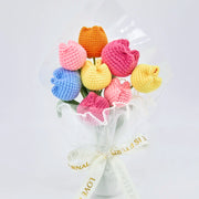 Multicoloured crochet tulip bouquet in transparent wrapping