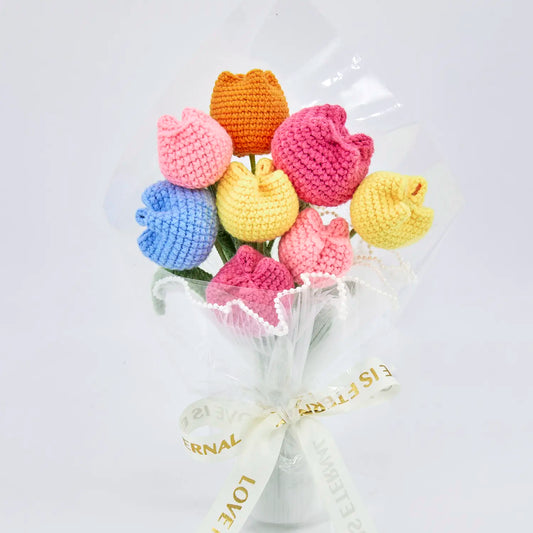 Multicoloured crochet tulip bouquet in transparent wrapping