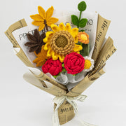 Crochet bouquet of sunflowers, red roses and crochet maple leaves