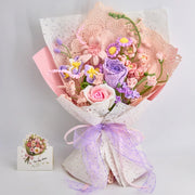 Crochet bouquet of roses and delphiniums in pink and purple