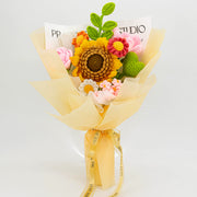 Yellow and green crochet bouquet with an oversized sunflower, roses and daisies