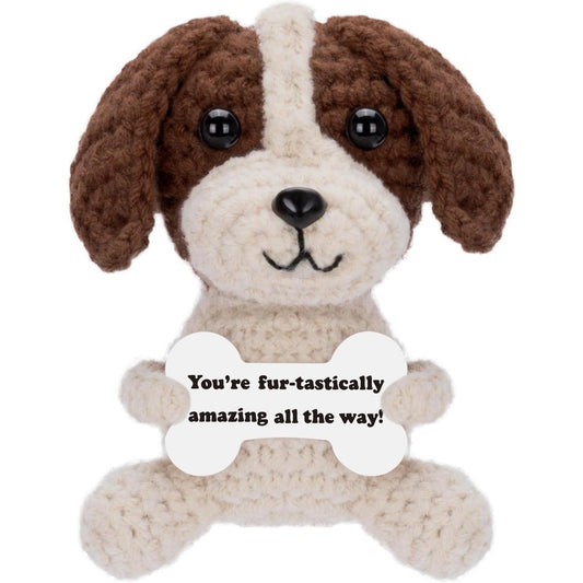 Crochet emotional support dog holding a message card