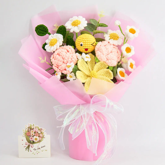 Crochet bouquet of roses and daisies with a crochet emoji face