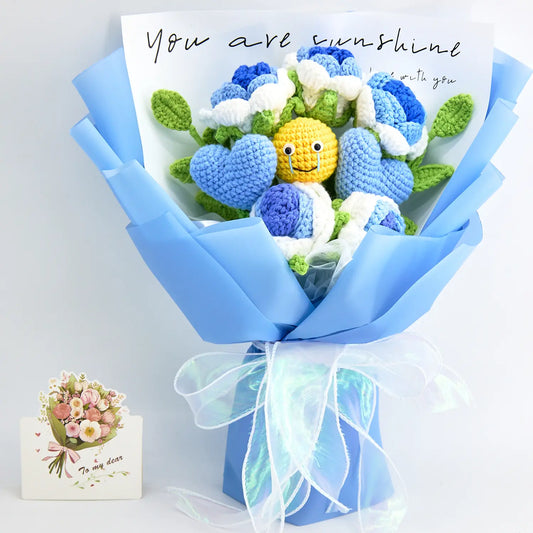 Crochet bouquet of blue roses with a crochet emoji face