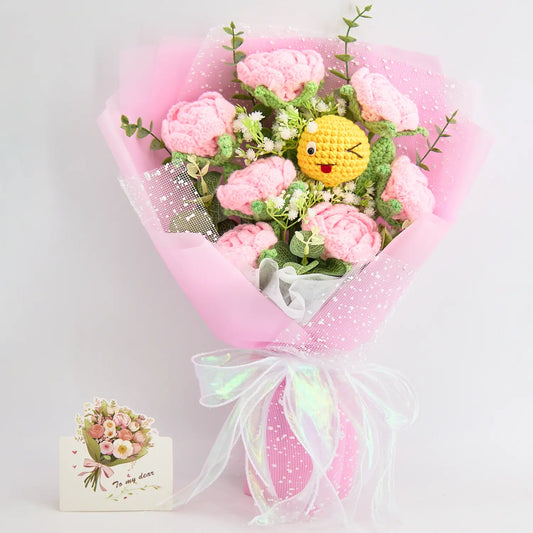Crochet bouquet of pink roses with a crochet emoji face