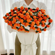 Crochet flower blanket worked in orange roses
