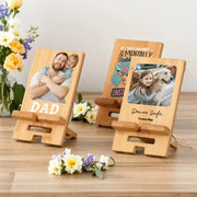 Wooden phone holder engraved with a custom photo and text