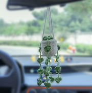 Crochet car hanging with four trailing branches of green leaves