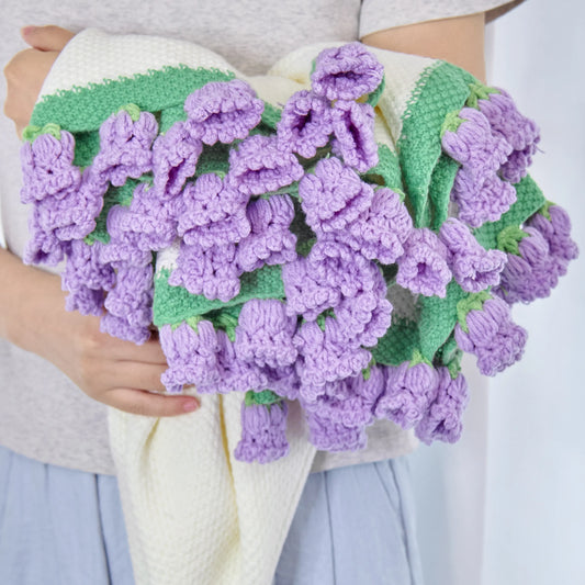 Crochet flower blanket worked in purple bellflowers