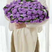 Crochet flower blanket worked in purple roses