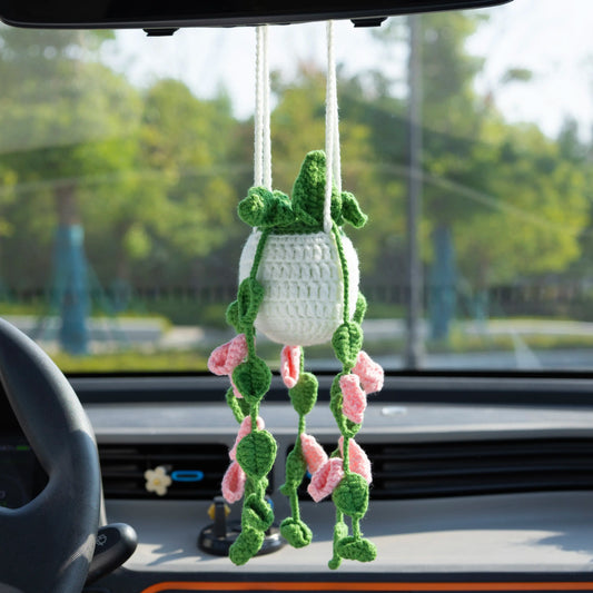 Crochet car hanging with pink flowers in a white pot
