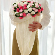White crochet flower blanket with white to pink ombre roses