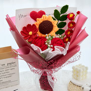Red crochet bouquet with roses, a sunflower and a crochet heart