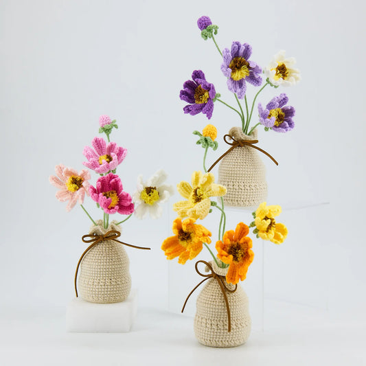 Crochet flowers arranged in a crocheted vase for desk decoration