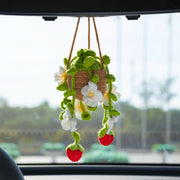 Crochet hanging pot with four strawberry branches, each with flower, leaves and fruit