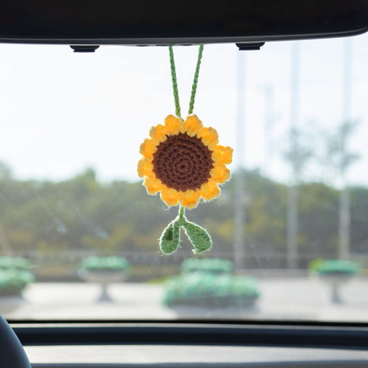 Minimal crochet sunflower car hanging with two green leaves