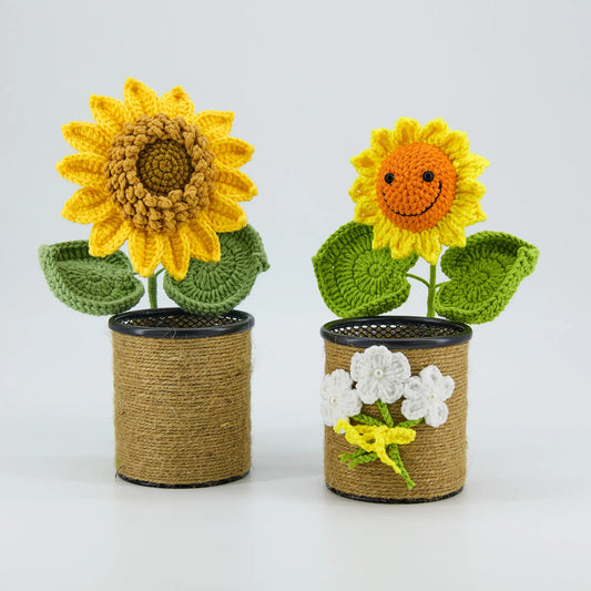 Crochet sunflower pen holder in a brown pot with a smiling face
