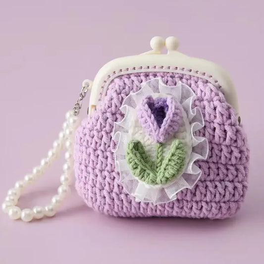 Crochet coin purse in cotton yarn with a raised crochet tulip